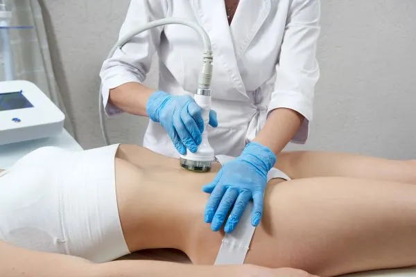 Lost the Weight but Not the Loose Skin? 2 woman having HIFU treatment on her stomach to combat loose skin Stoke on Trent following weight loss